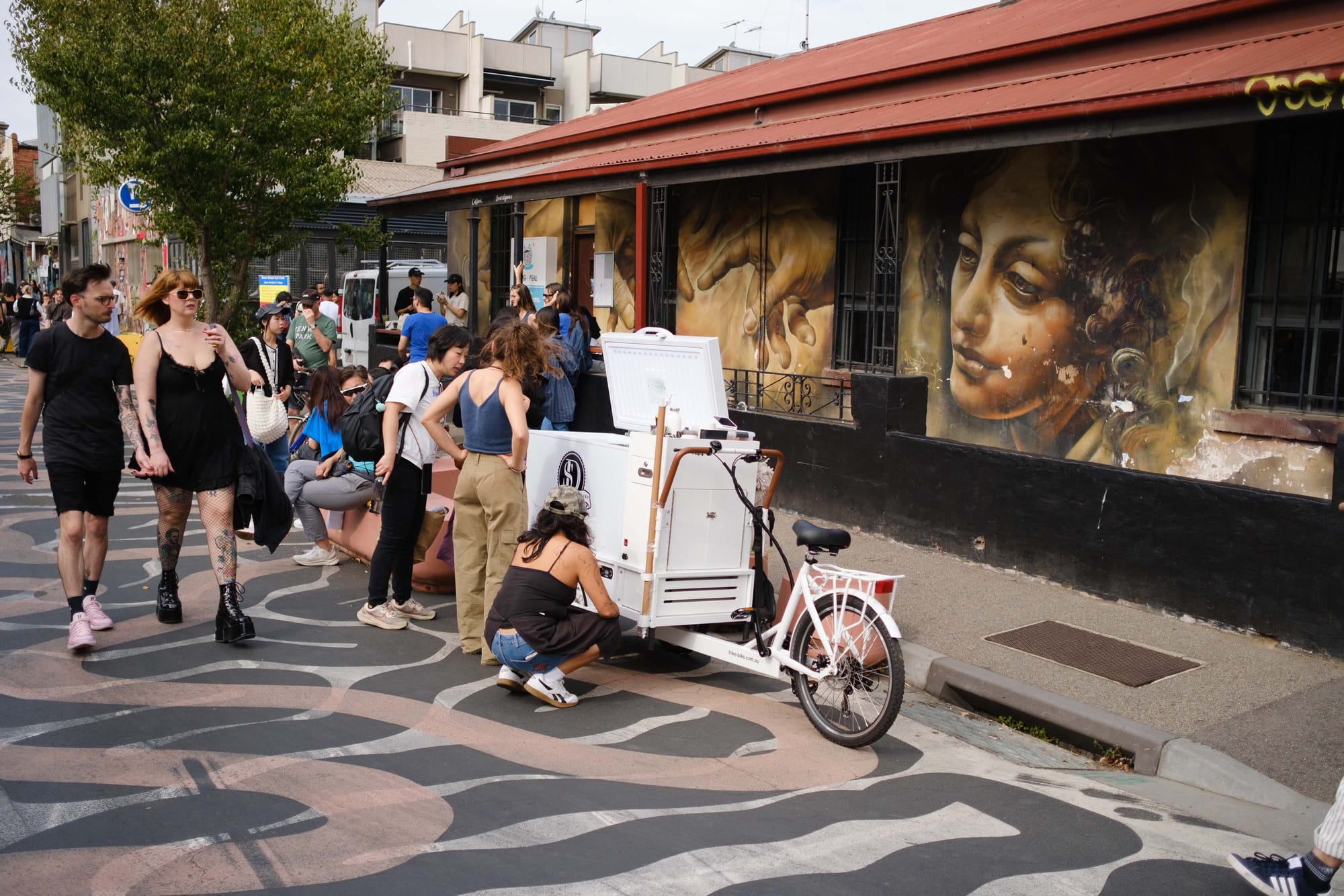 A cargo bike serving ice cream in a pedestrian priority street in Melbourne.