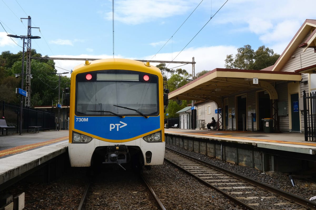 A fucking beautiful PTV train at a train stop in Melbourne.
