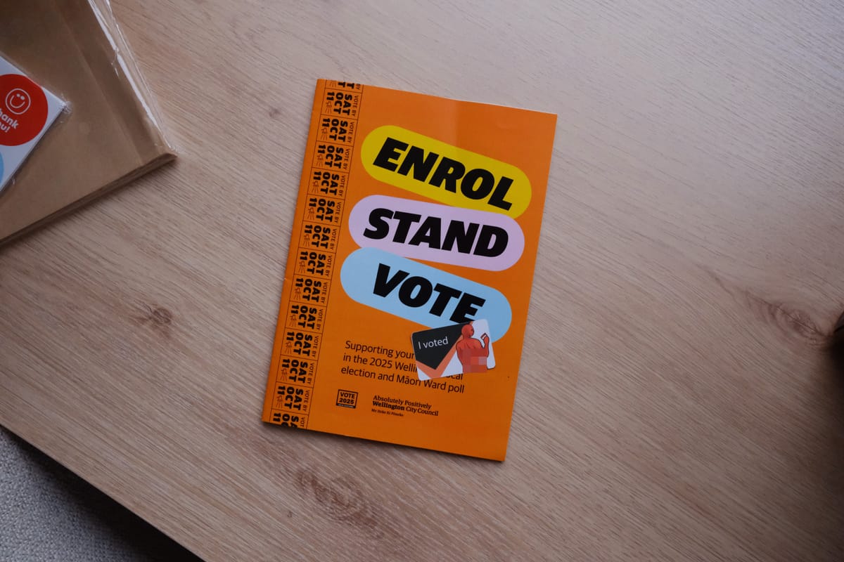 A voting guide from Wellington City Council on a desk. An "I voted" sticker is on top. 