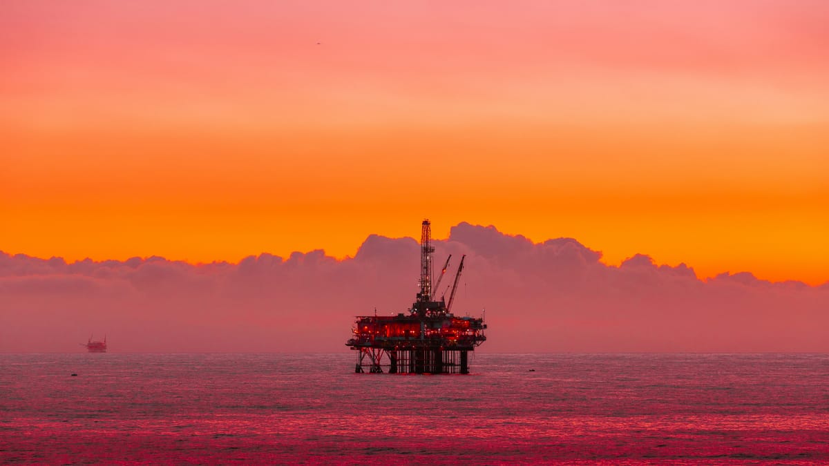 An oil rig at sunset.