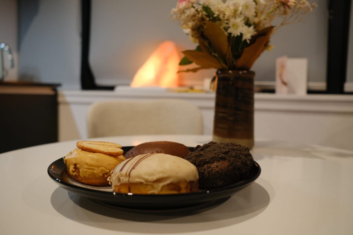 Four vegan donuts from Vonuts on my kitchen table.