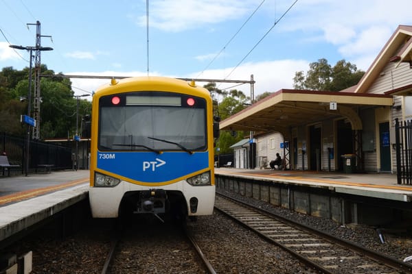 A fucking beautiful PTV train at a train stop in Melbourne.